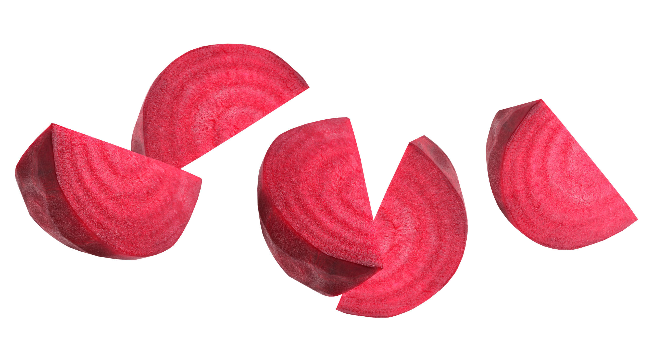Falling (flying) pieces of beetroot isolated on white background. peeled pieces of vegetable.  root.